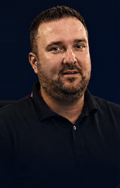 Kyle, a Shield customer, in a dark polo shirt.
